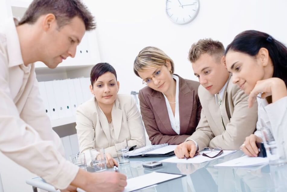Colleagues reviewing plans together